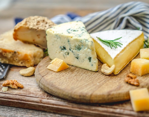 Vegan cheese platter with assorted nuts and fruits in Paris, France.