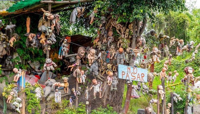 Xochimilco's Island of the Dolls with hanging dolls in Mexico.