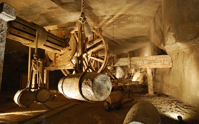 Wieliczka Salt Mine vintage machinery with wooden gears and ropes.