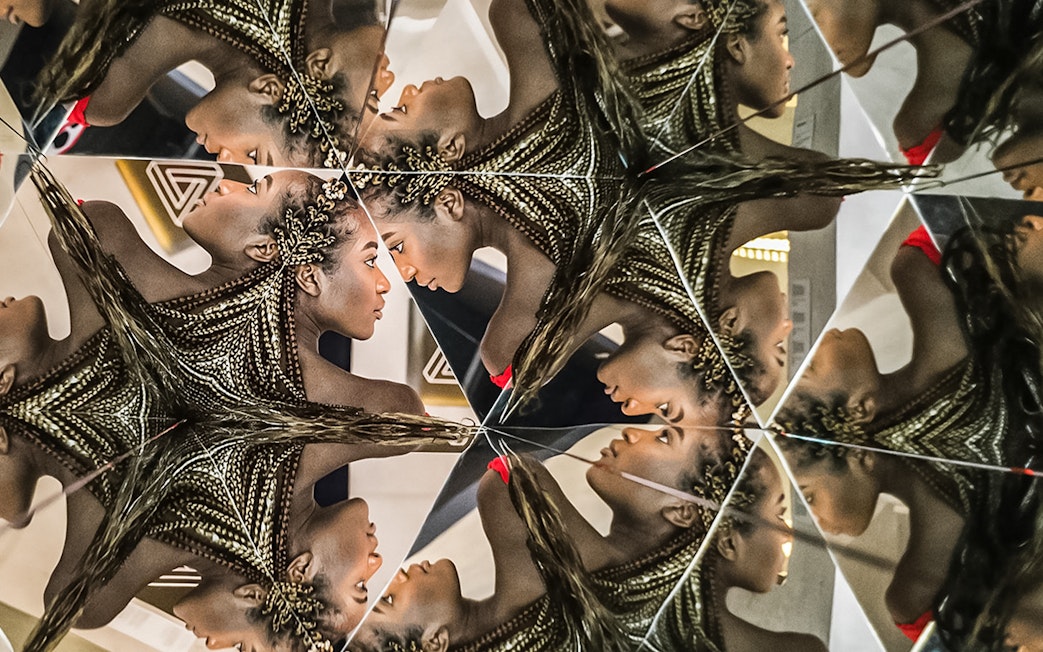 Mirrored reflections in Illuseum Berlin's Infinity Room.