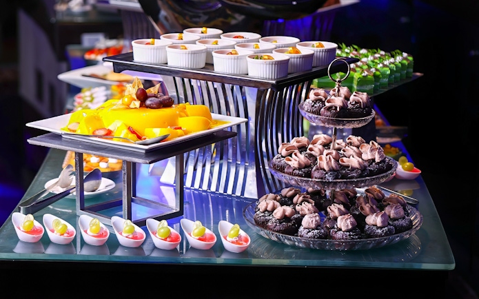 Dinner buffet with desserts and fruit at ARAS restaurant, KL Tower, Kuala Lumpur.
