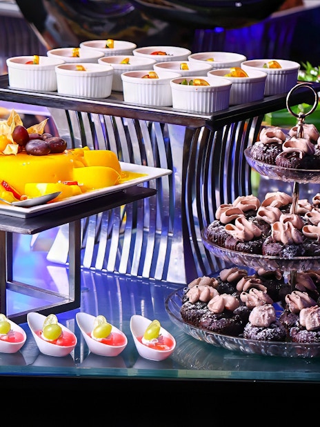 Dinner buffet with desserts and fruit at ARAS restaurant, KL Tower, Kuala Lumpur.