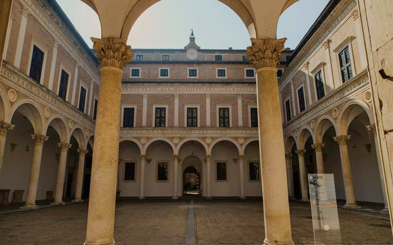 Courtyard of Palazzo Ducale in Urbino during a guided tour.
