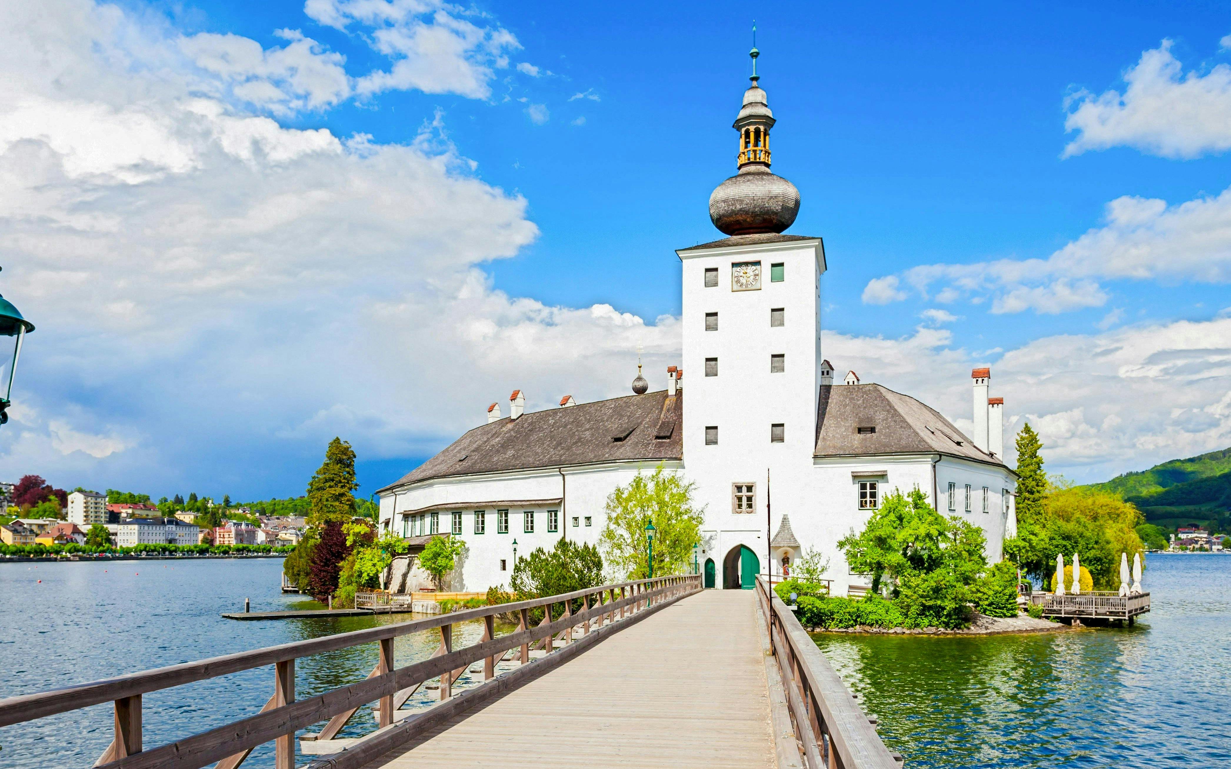 Schloss Ort castle with wooden bridge over lake in Hallstatt, Austria.
