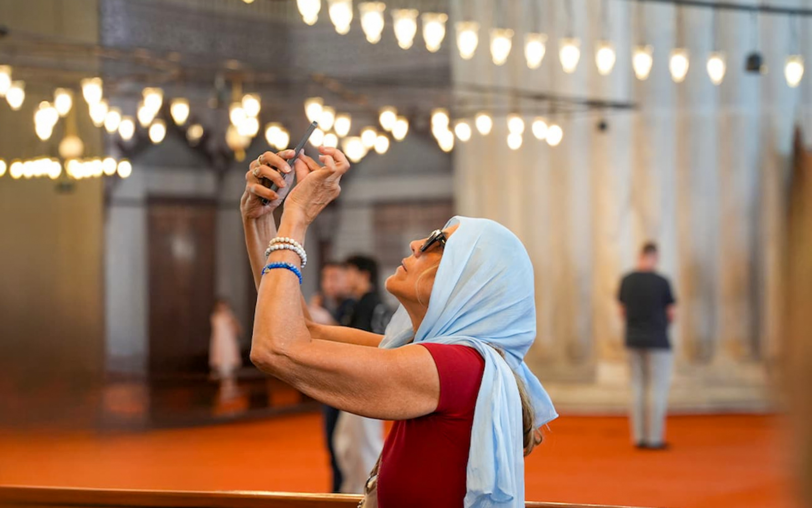 Guest taking photos inside the Blue Mosque, Istanbul.