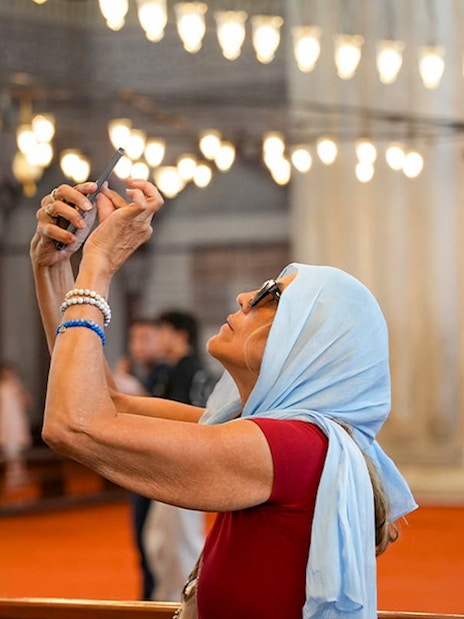 Guest taking photos inside the Blue Mosque, Istanbul.