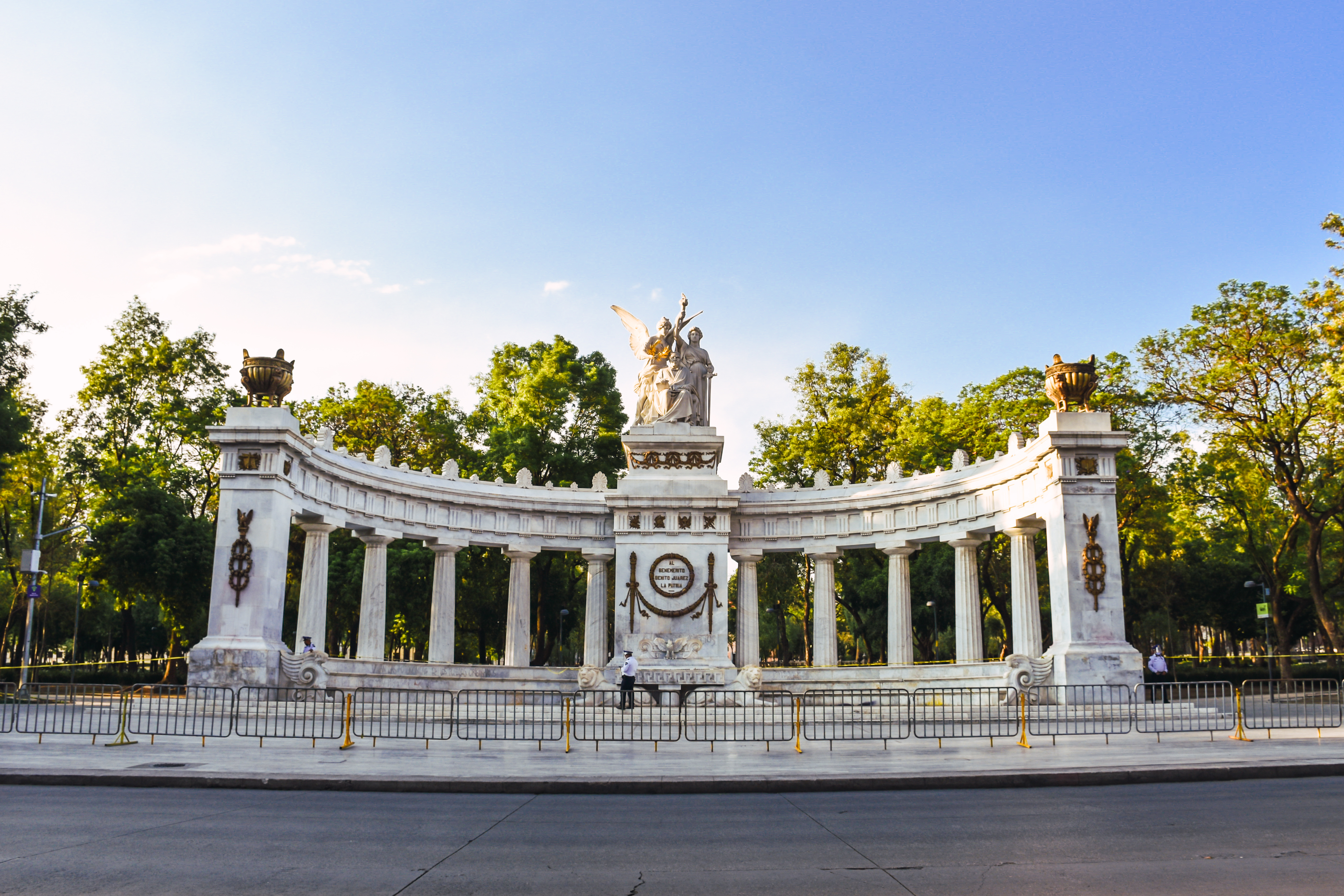 Juarez Hemicycle in Mexico City with tourists exploring the historic monument.