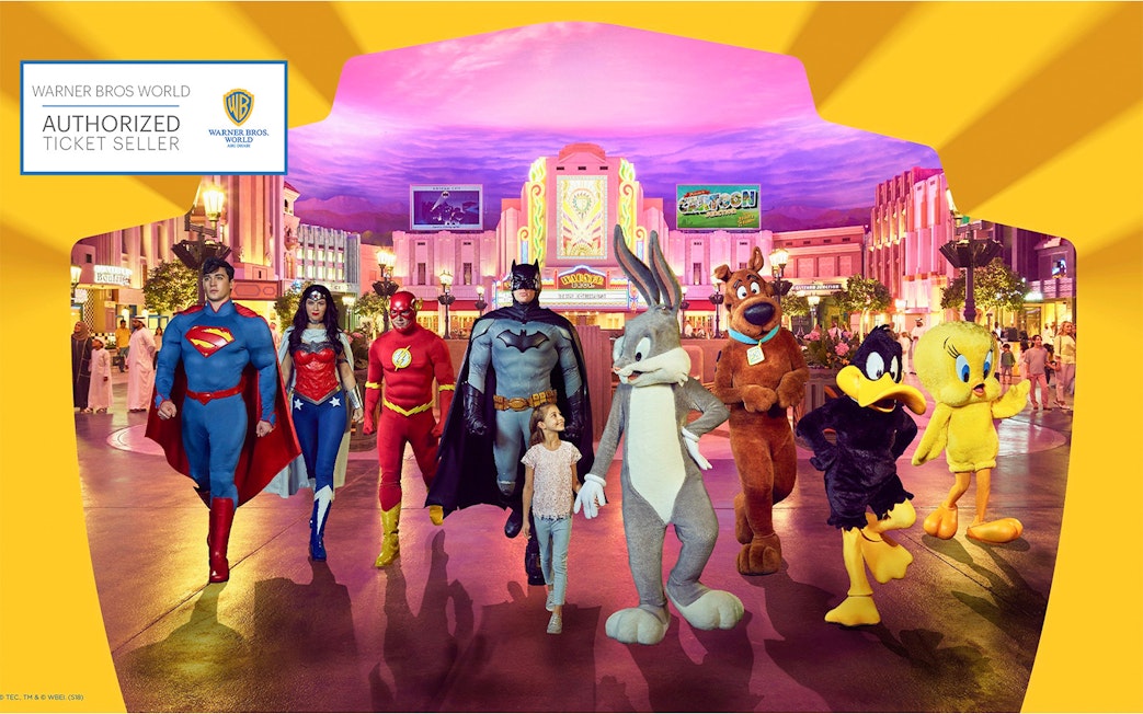 Warner Bros. World Abu Dhabi characters with child in theme park setting.