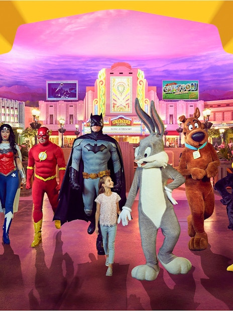 Warner Bros. World Abu Dhabi characters with child in theme park setting.