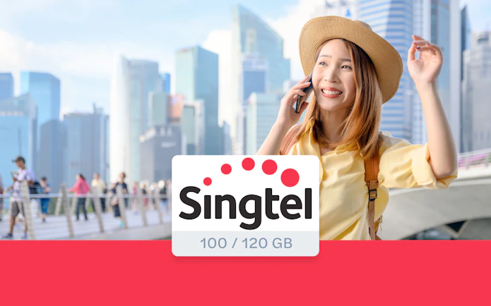 Tourist using Singtel prepaid SIM card in Singapore cityscape.