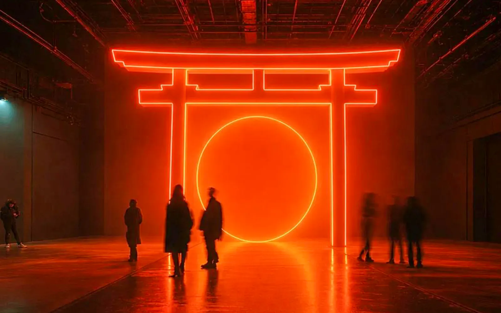 Guests exploring neon-lit art installation at Iniesta Experience in Barcelona.