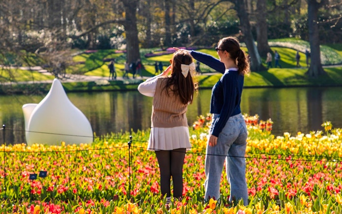 Guests enjoying tulip fields at Keukenhof Gardens, Amsterdam.