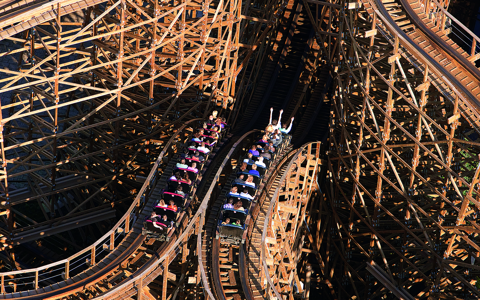 Rollercoaster ride at Efteling Theme Park with wooden tracks and passengers.