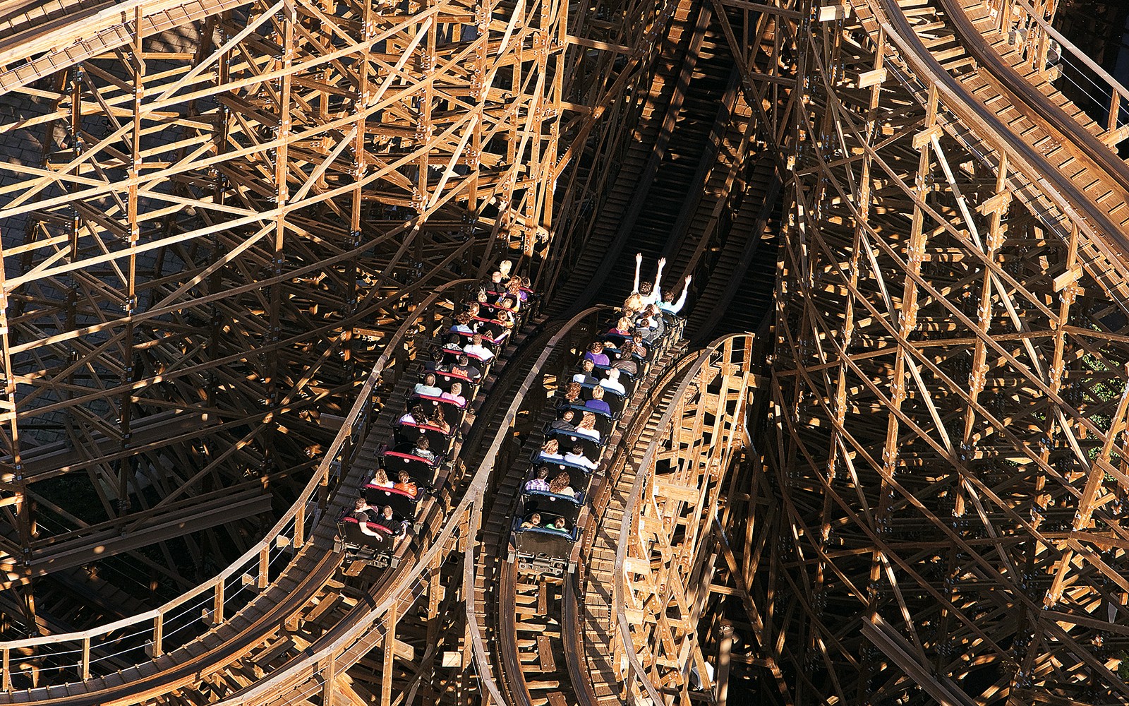 Rollercoaster ride at Efteling Theme Park with wooden tracks and passengers.