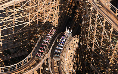 Rollercoaster ride at Efteling Theme Park with wooden tracks and passengers.