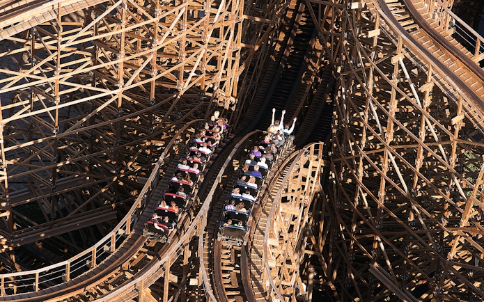 Rollercoaster ride at Efteling Theme Park with wooden tracks and passengers.