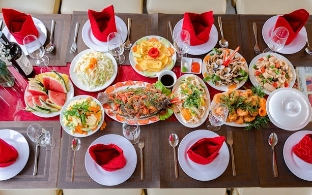 Buffet spread with seafood, salads, and fruit on Deluxe Day Cruise to Ha Long Bay.