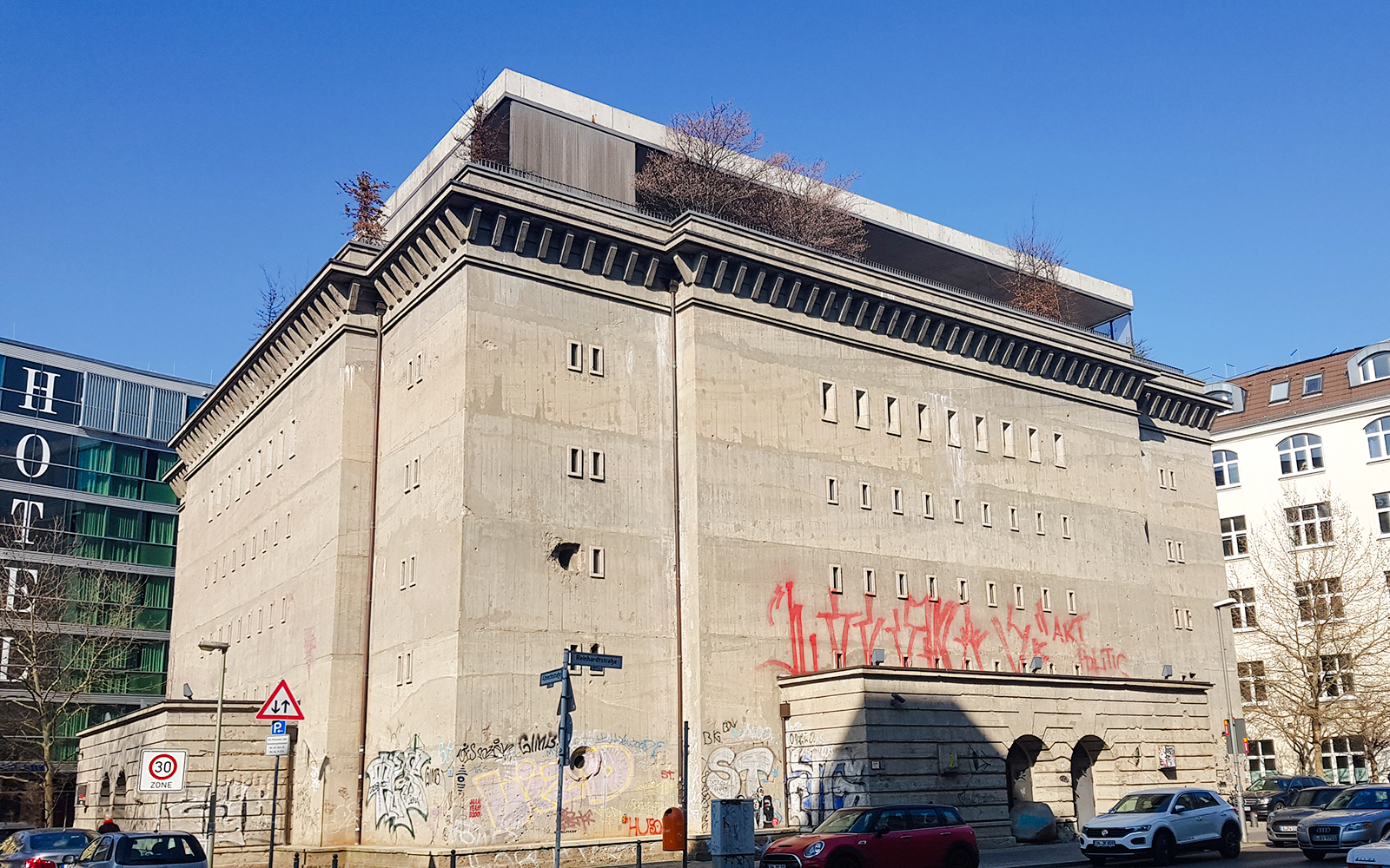 WWII-era bunker in Berlin with graffiti on concrete walls.