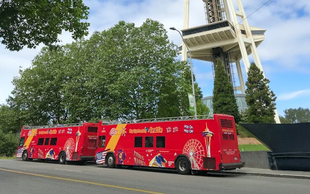 City Sightseeing bus at Seattle bus stop near Space Needle.
