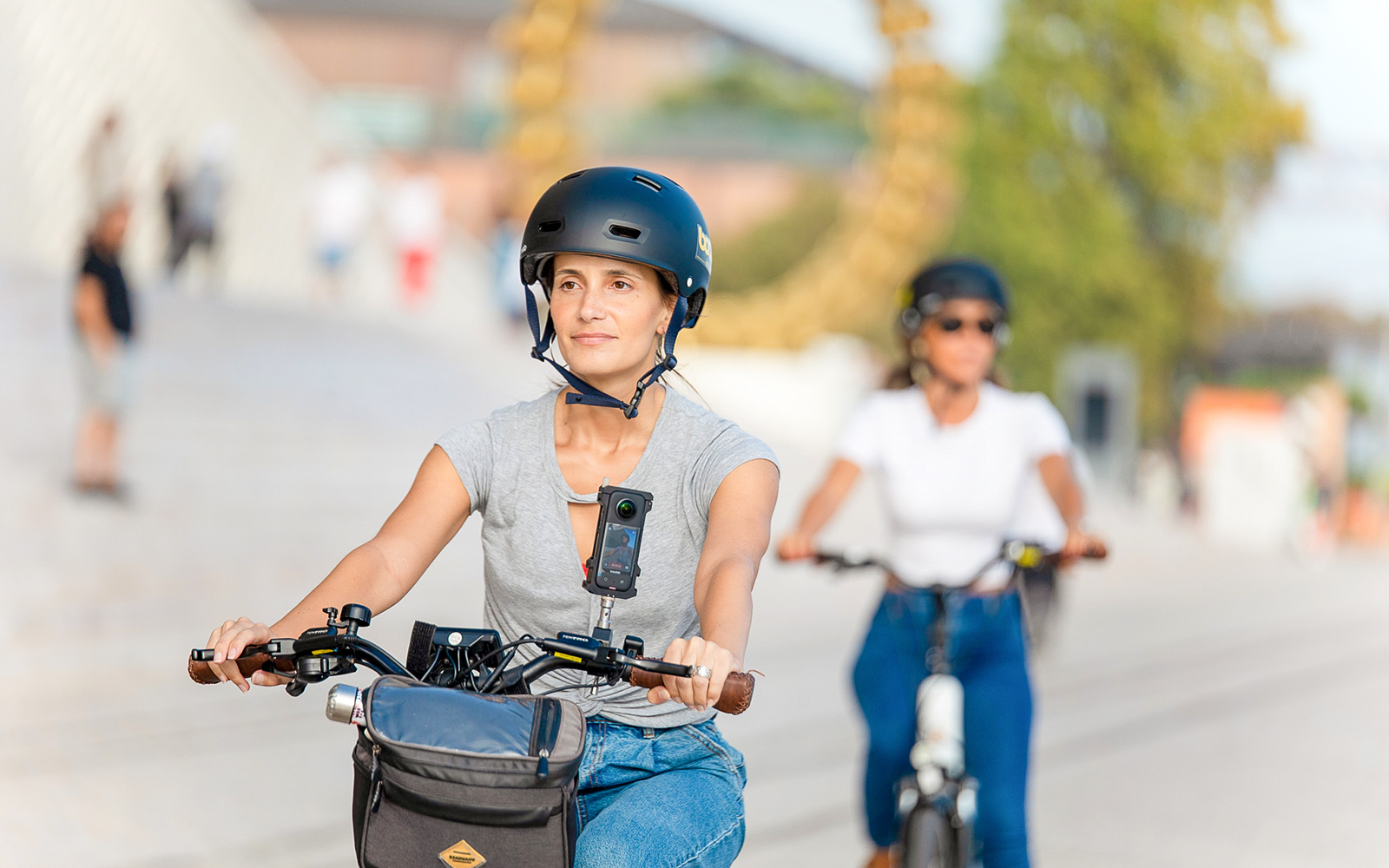 Tourists biking through Lisbon with helmet cameras.