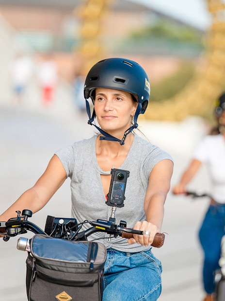 Tourists biking through Lisbon with helmet cameras.