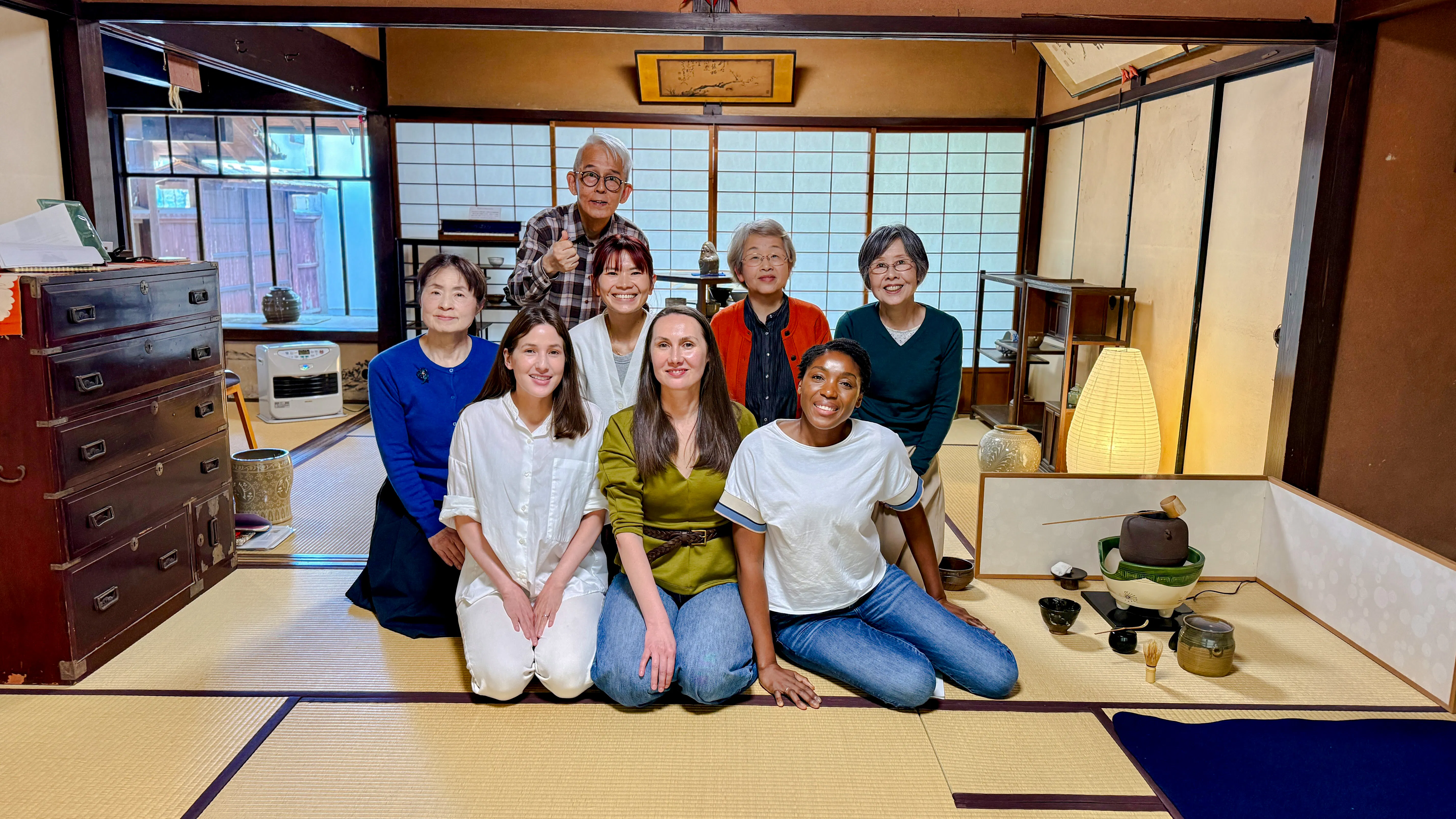 Group enjoying tea ceremony at cultural house in Hyogo, Japan.