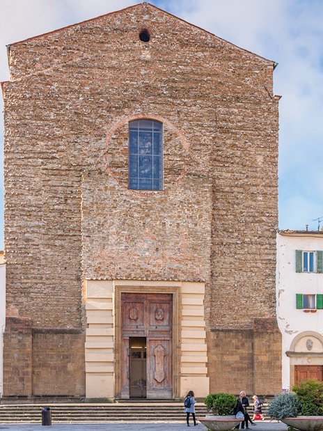 Church of Santa Maria del Carmine facade in Florence, Italy, with surrounding buildings.
