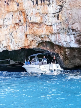 Boat entering Blue Cave on Lustica Peninsula, Montenegro.