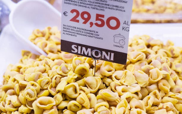 Tortellini display at Simoni shop during guided food tour in Bologna.