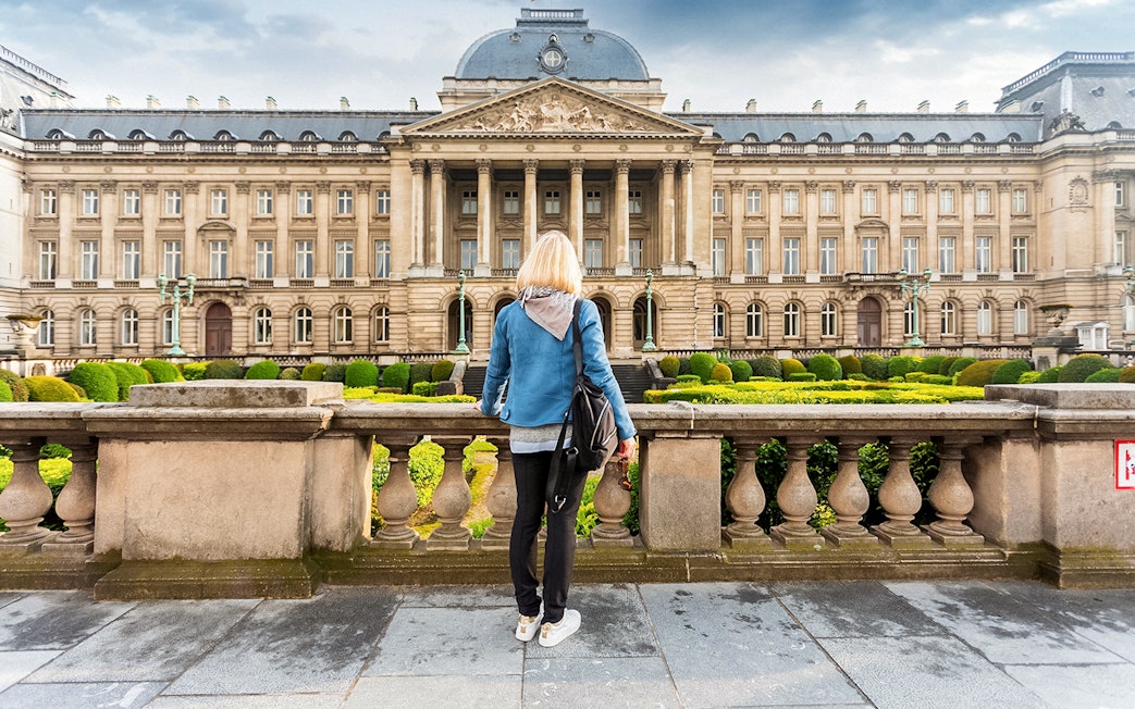 Royal Palace of Brussels viewed from the garden during a hop-on hop-off bus tour.