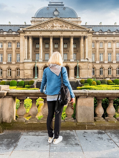 Royal Palace of Brussels viewed from the garden during a hop-on hop-off bus tour.