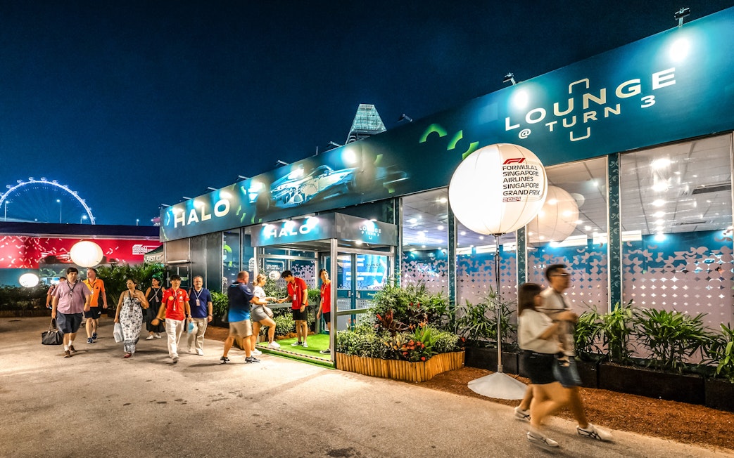 Marina Bay Street Circuit lounge entrance with visitors during Singapore Grand Prix.