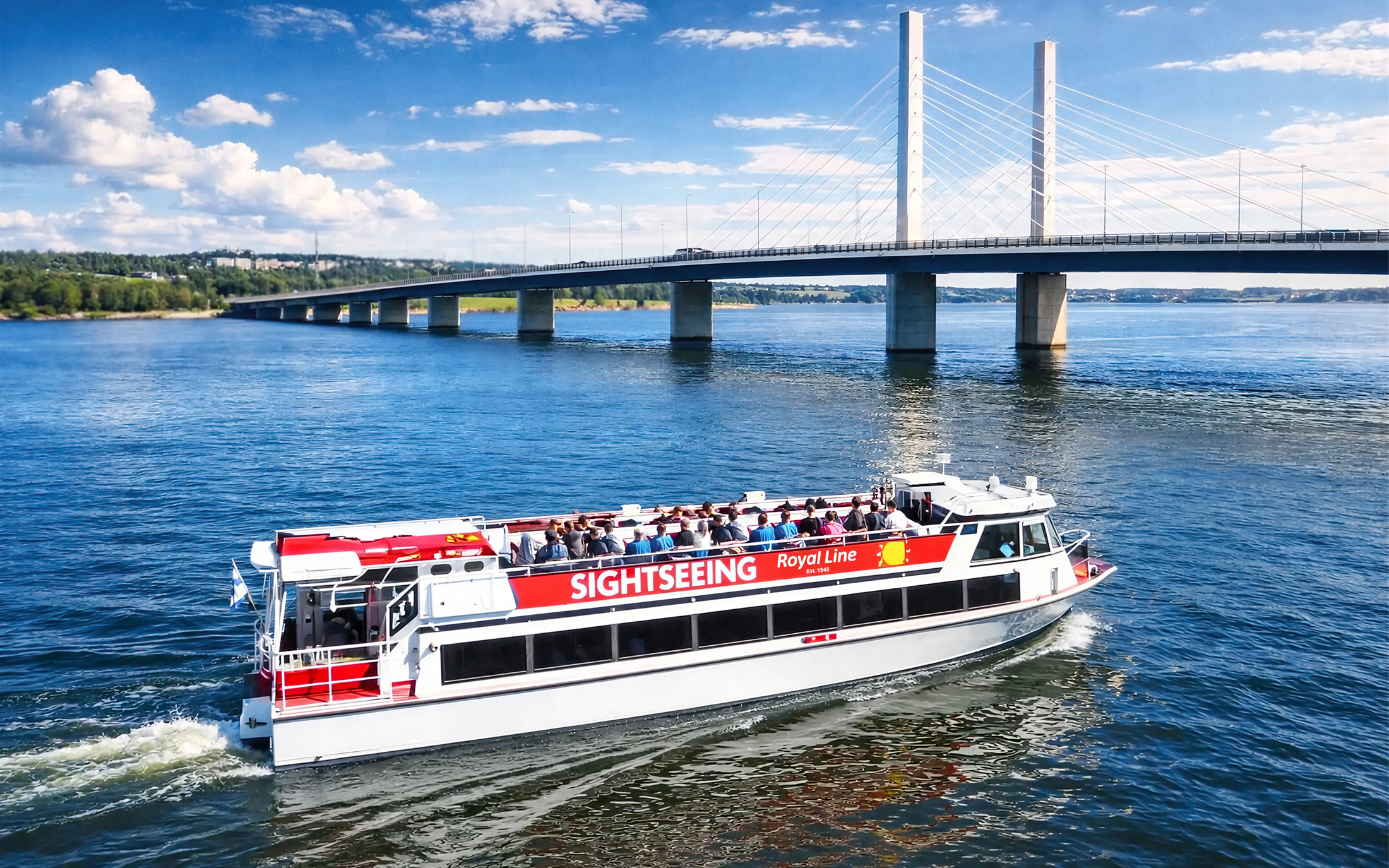 Sightseeing cruise boat near Kruununvuorensilta bridge, Finland.
