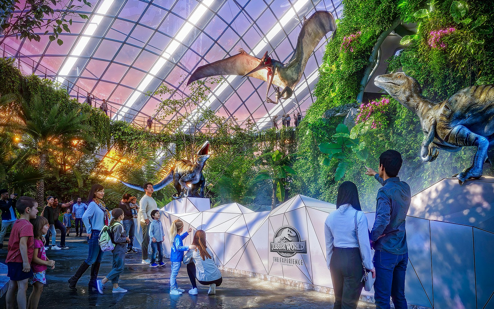 Visitors observing a pteranodon display at Jurassic World attraction.