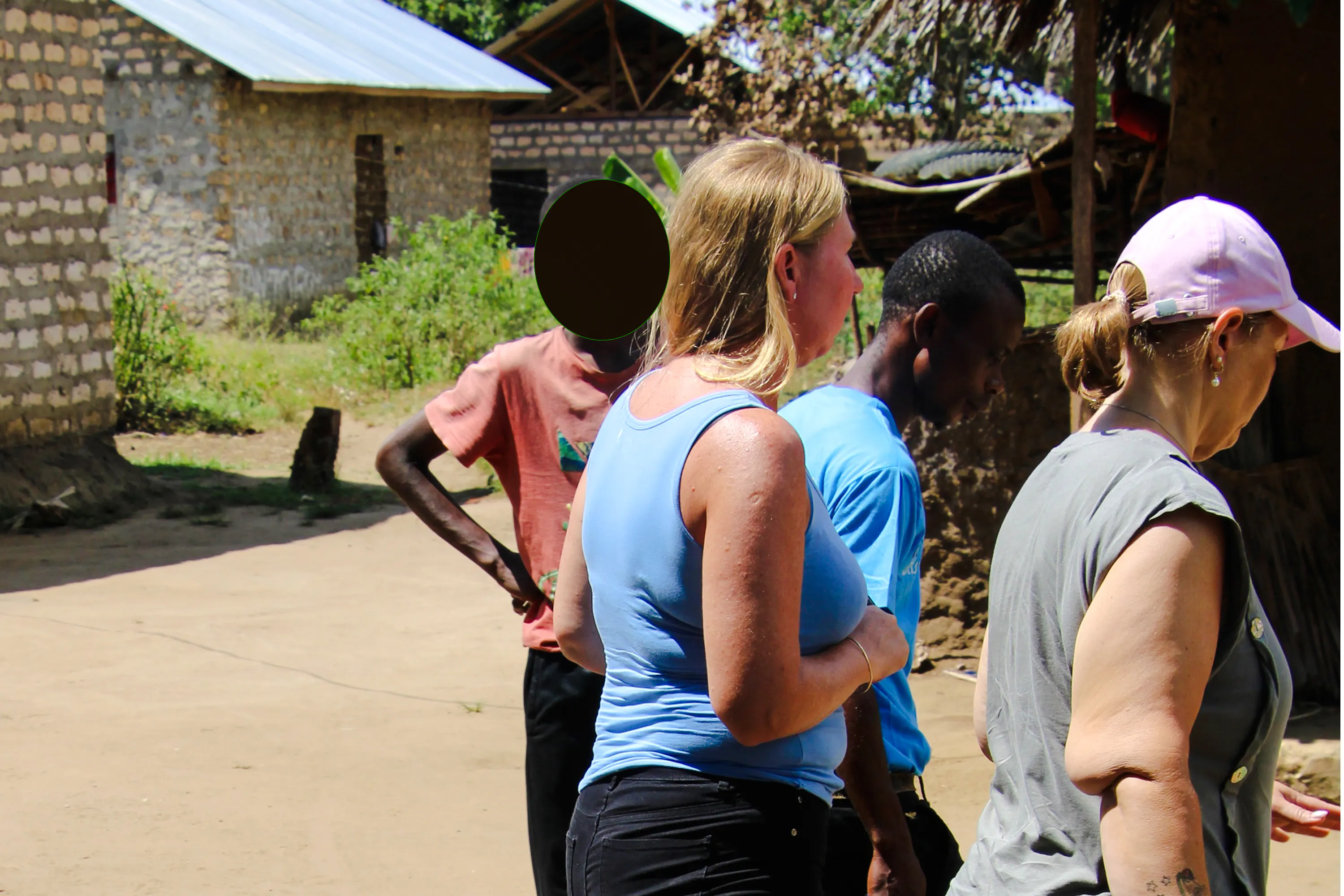 Visitors exploring a local village during the Giriama cultural dance tour in Diani Beach.
