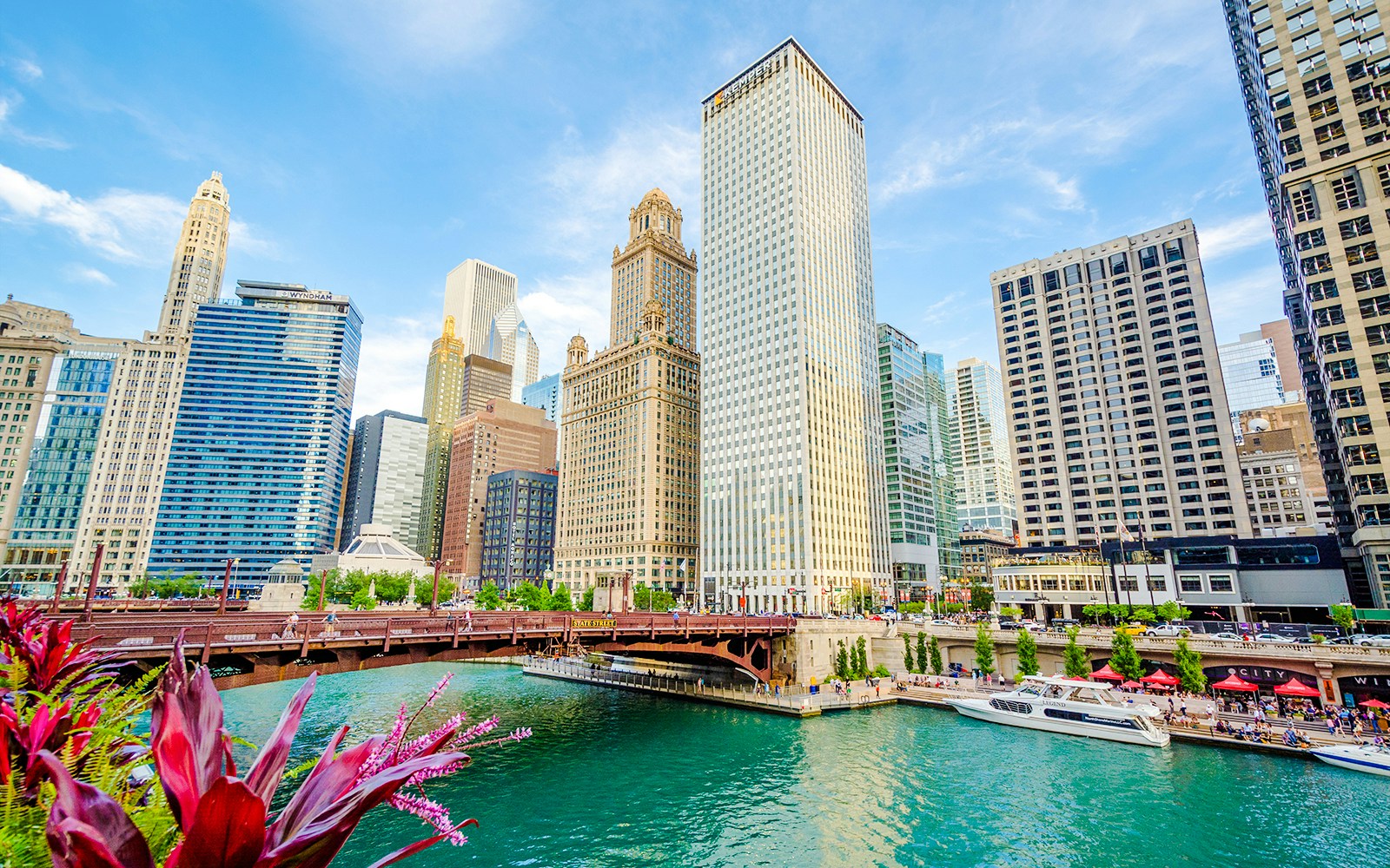 Chicago River with skyscrapers reflecting in the water, showcasing the city's iconic architecture.
