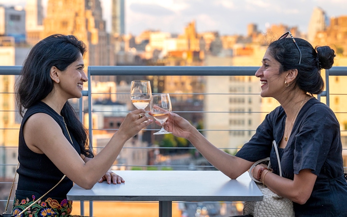 Guests enjoying drinks on the terrace of Whitney Museum of American Art.