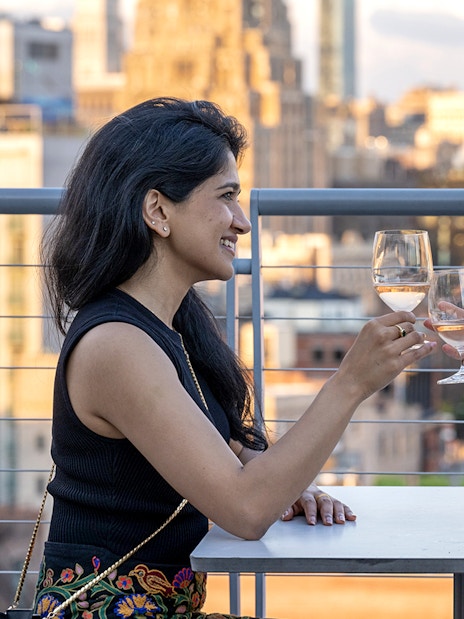 Guests enjoying drinks on the terrace of Whitney Museum of American Art.