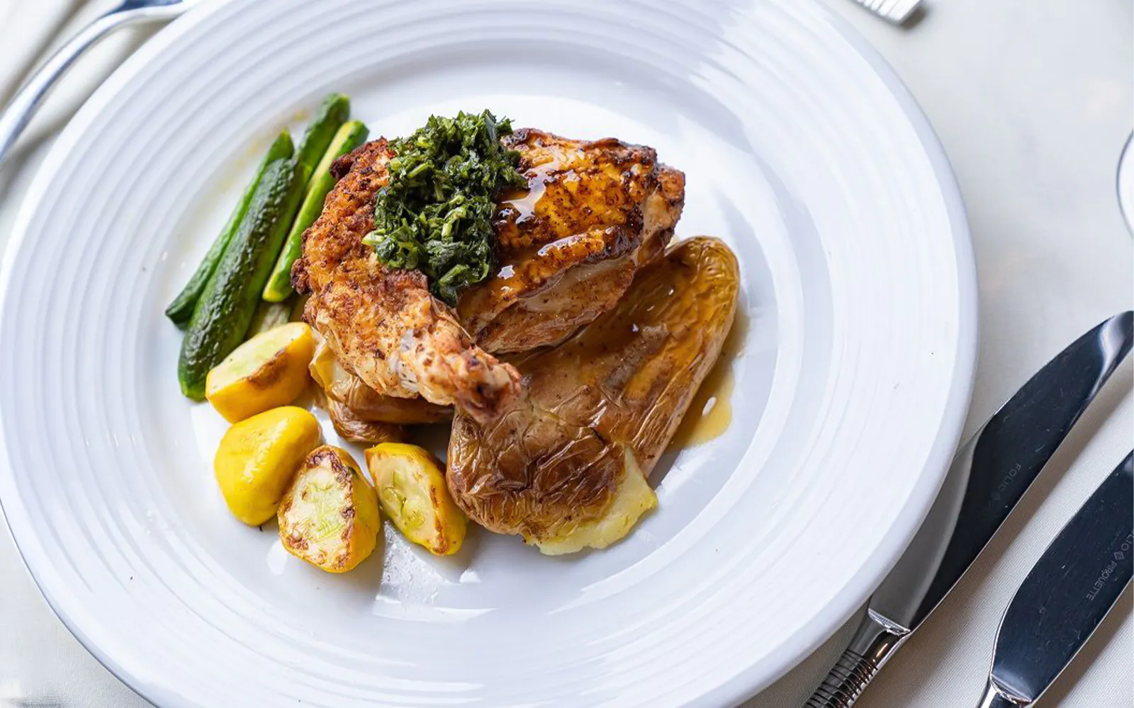 Grilled chicken with herbs, roasted potatoes, and vegetables on San Diego Premier Dinner Cruise.