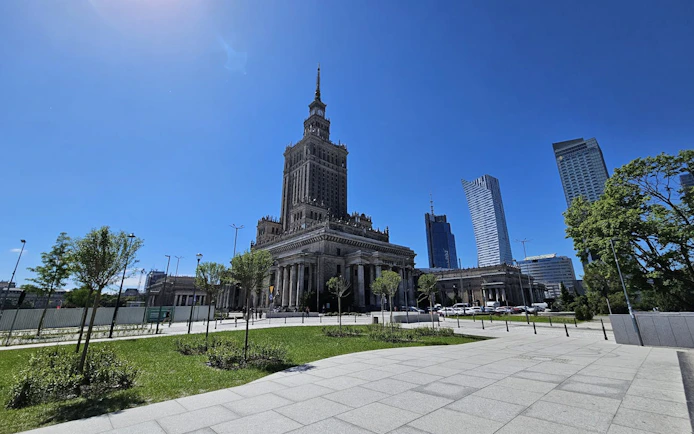 Palace of Culture and Science with observation deck, Warsaw skyline in background.