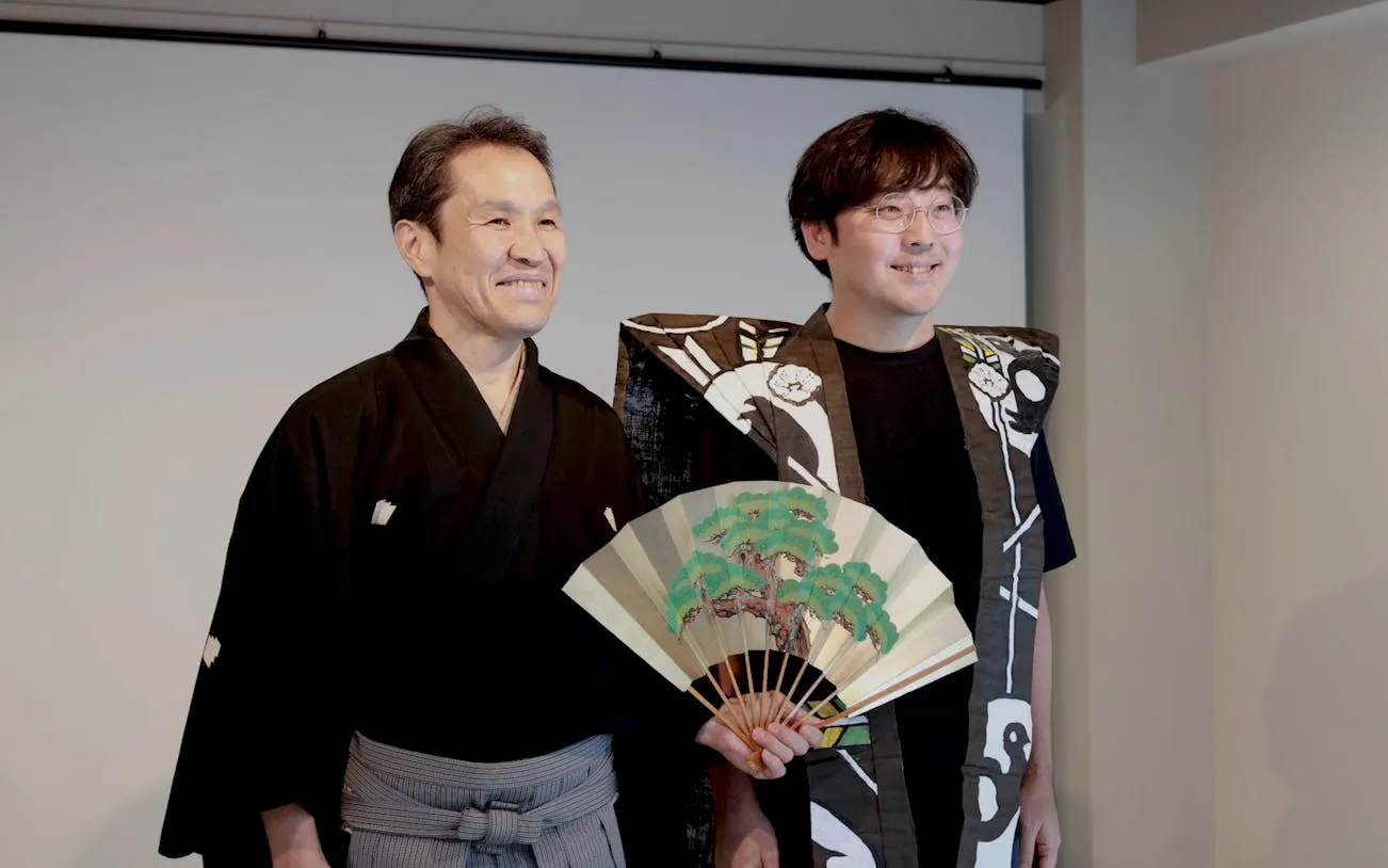Kyoto Noh theater workshop with master performer holding a traditional fan.