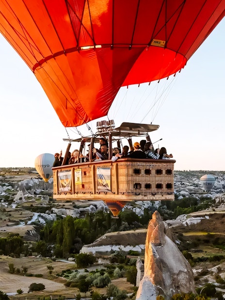 Hot air balloons over Cappadocia's unique rock formations.
