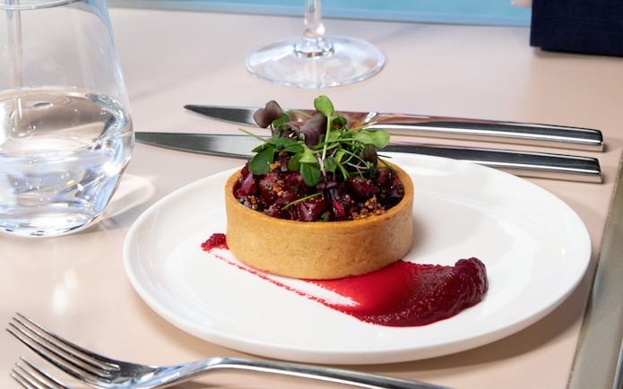 Three-course lunch tart with beet puree on Eiffel Tower day trip in Paris.