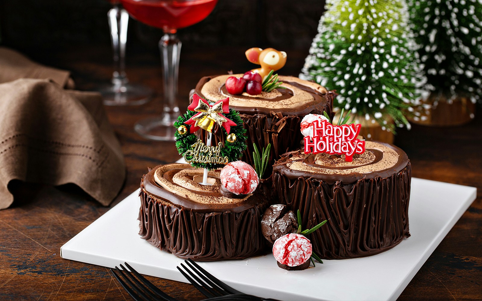 French yule log cake with holiday decorations, Christmas in Paris.