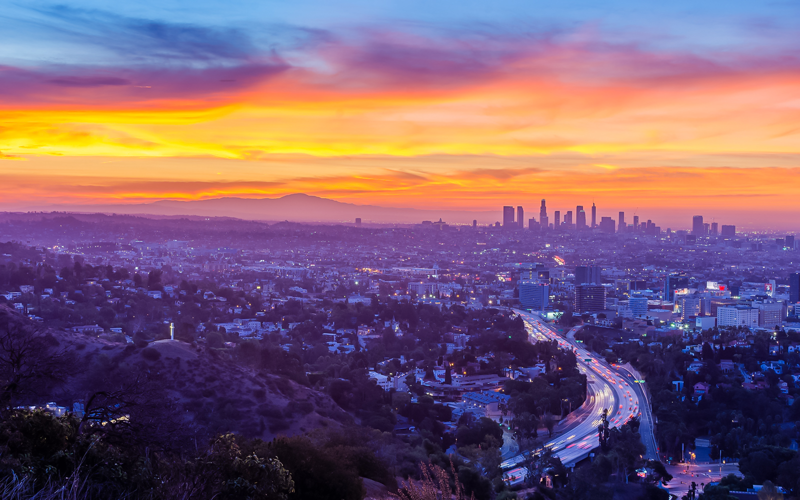 Sunrise view of Los Angeles skyline from Hollywood Bowl Overlook.