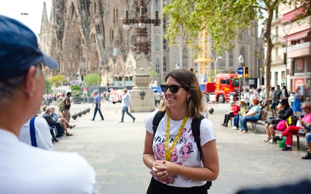 Guide speaking to tour group outside Sagrada Familia in Barcelona.