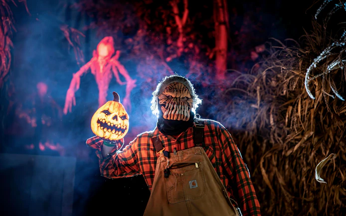 Halloween character with pumpkin mask at Canada's Wonderland Halloween Haunt.