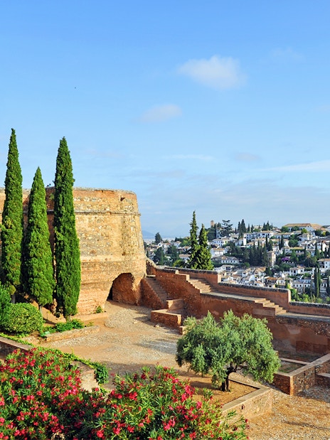 Alcazaba fortress and gardens with view of Granada, Spain.