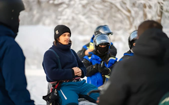 Group preparing for snowmobile ride in Tromso.
