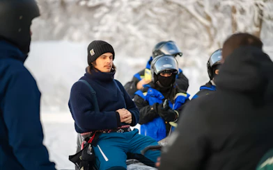 Group preparing for snowmobile ride in Tromso.